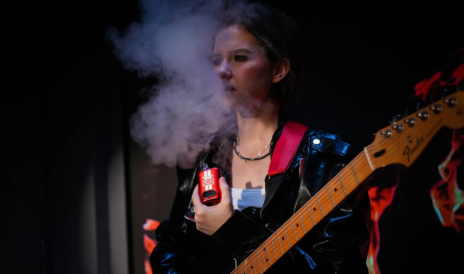 A man exhaling vapor from a VAPORESSO VIBE device, illustrating the "HyperFlow" technology for instant absorption and consistent enjoyment.